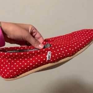 Read and white polkadot TOMS shoes